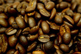 Christmas Flavoured Whole Roasted Coffee Beans Gently Stirred