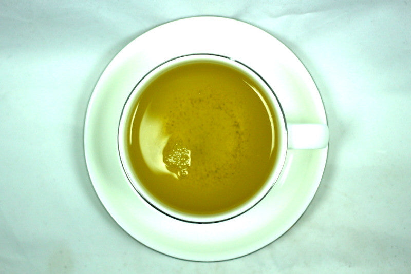 Dragonfruit Pomegranate White and Green Tea Blend Gently Stirred