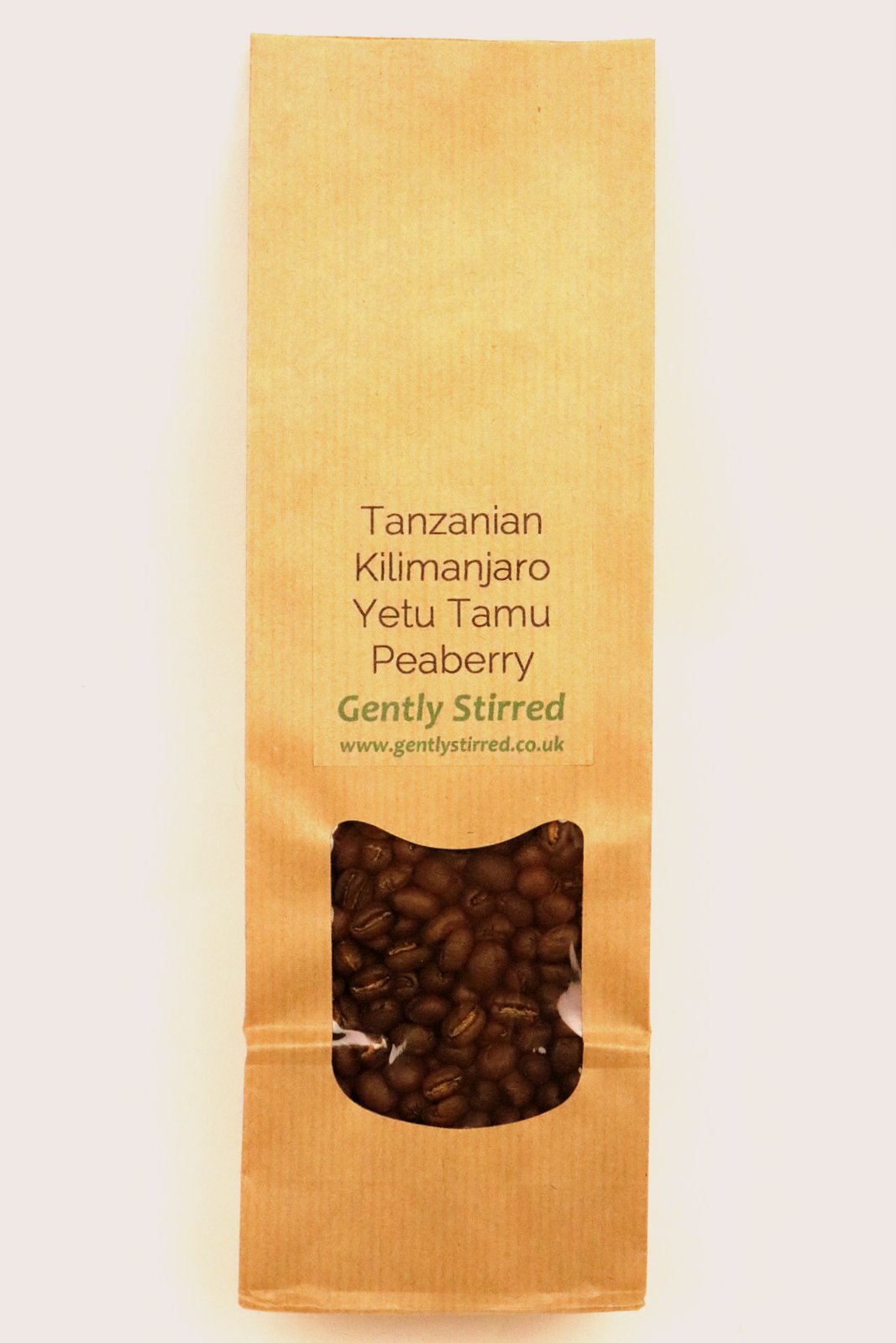 Tanzania Kilimanjaro Yetu Tamu Peaberry Whole Bean Coffee Gently Stirred