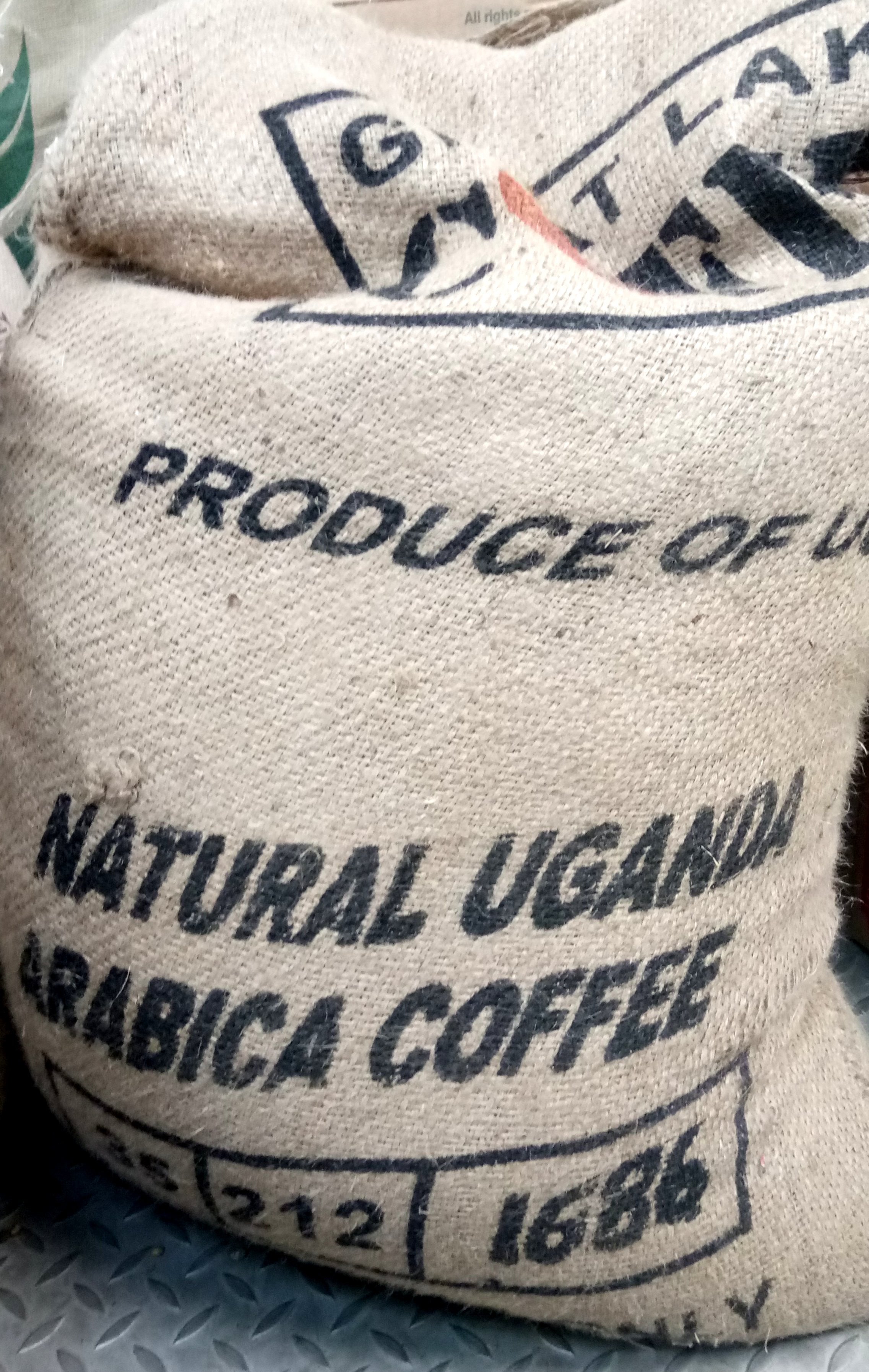Uganda Drugar AA Natural Process Dark Roast Coffee Beans Gently Stirred