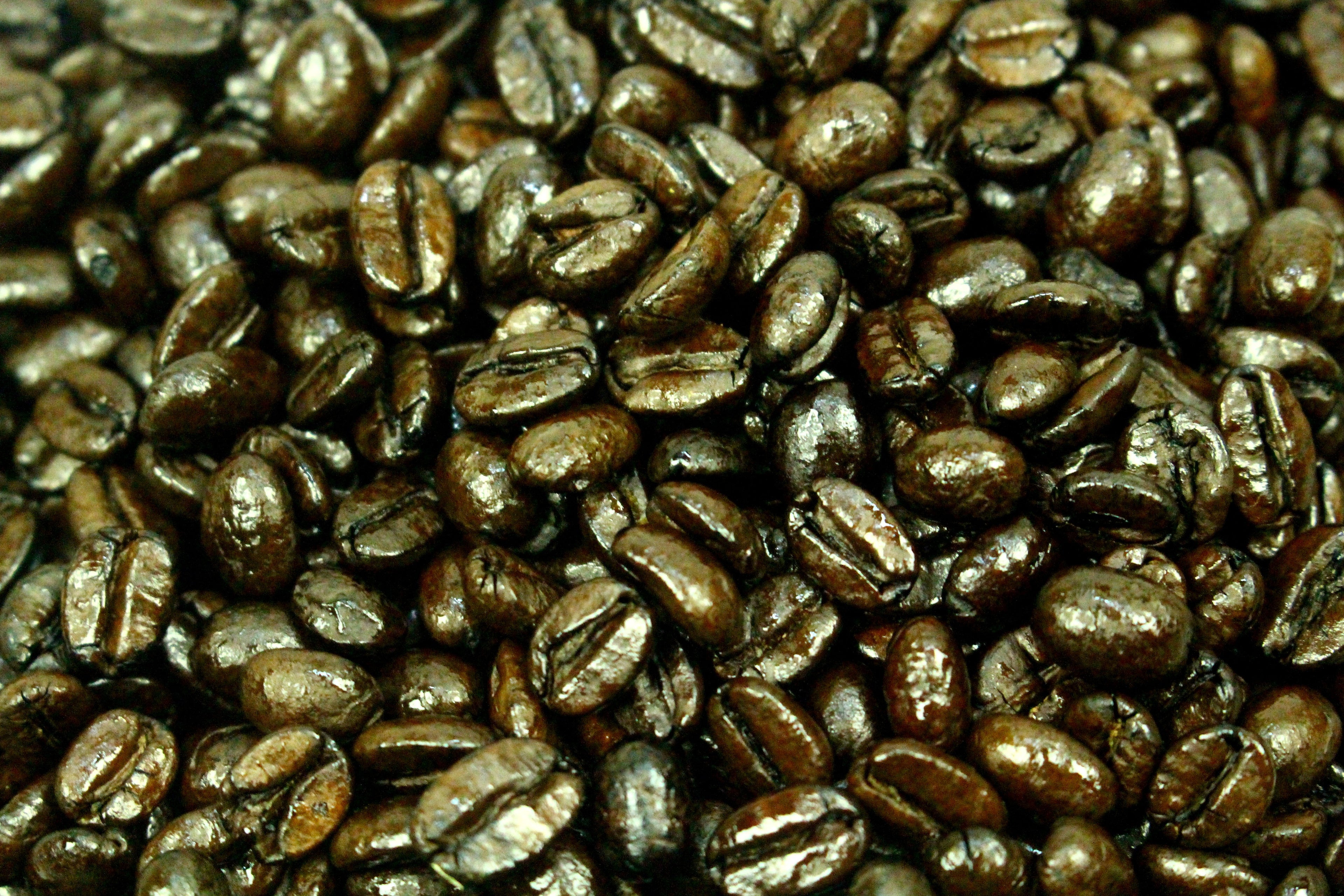 Uganda Drugar AA Natural Process Dark Roast Coffee Beans Gently Stirred