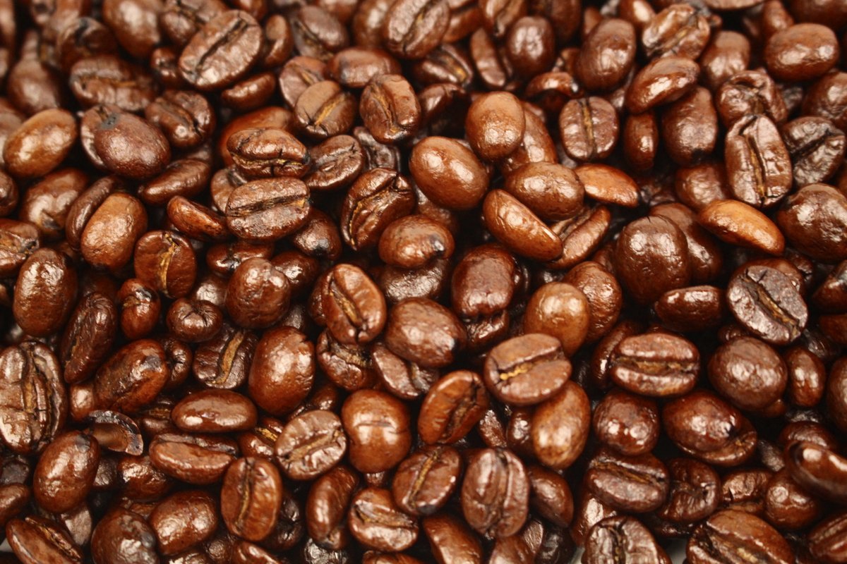 Vanilla Cream Flavoured Whole Coffee Beans Gently Stirred