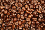 Vanilla Cream Flavoured Whole Coffee Beans Gently Stirred