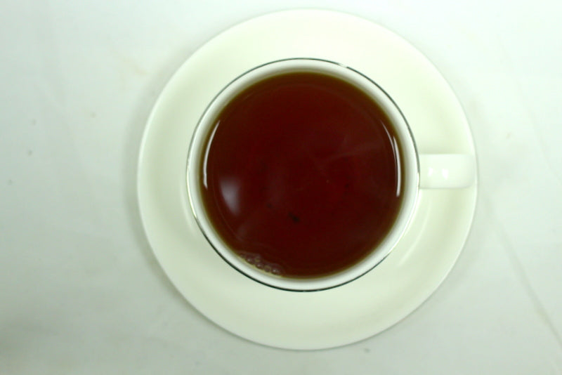 Wild Black Cherry Flavoured Loose Leaf Black Tea Gently Stirred